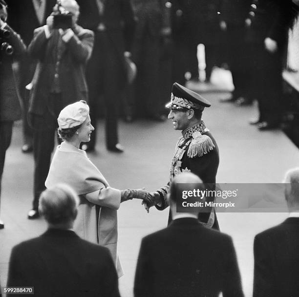 Mohammad-Reza Shah Pahlavi, the Shah of Iran, with Queen Elizabeth II during his visit to Britain. 5th May 1959.