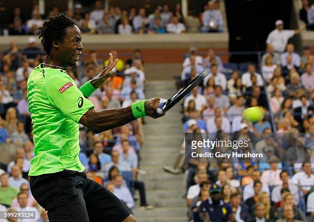 Gael Monfils of France hits to Roger Federer of Switzerland during their match at the US Open in New York, September 3, 2014.