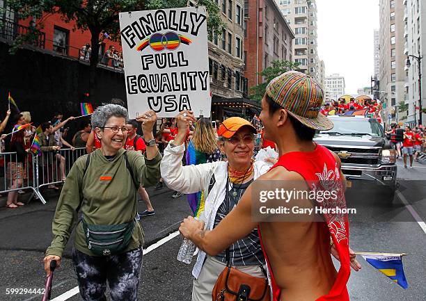 Participants march in the annual Gay Pride Parade in New York, June 28, 2015.