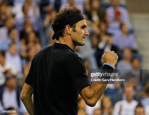 Roger Federer of Switzerland celebrates winning a game in the fifth set against Gael Monfils of France during their match at the US Open in New York,...