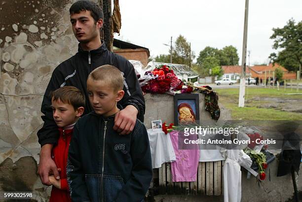 Family pays homage to the victims at Beslan Number 1 school, the scene of the siege. 318 civilians, including 186 children, died during the three-day...