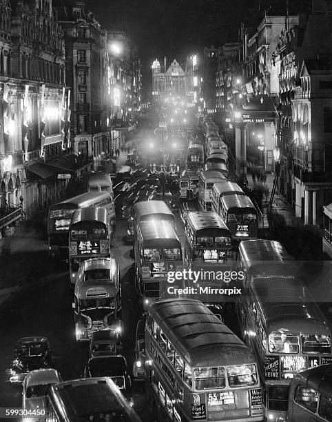 Queen Elizabeth II Coronation Buses, taxis and private cars seen here driving through the Haymarket London, taking in the shops especially decorated...