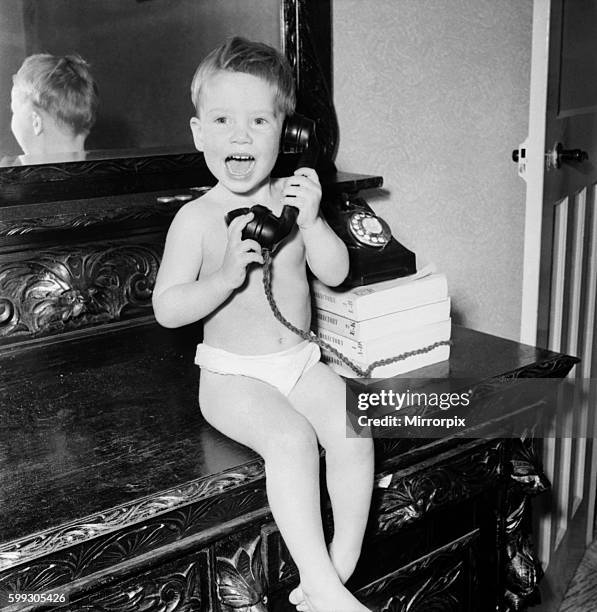 The Pickle family is a strong family as these picture show mum and dad weight training with son Eric seen here on the telephone to his agent....