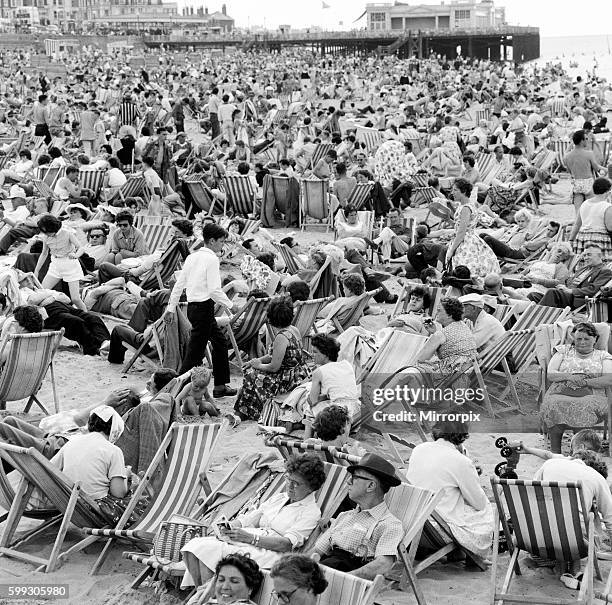 Hot weather scenes on the beach in Margate, Kent, during August Bank Holiday. 5th August 1962.