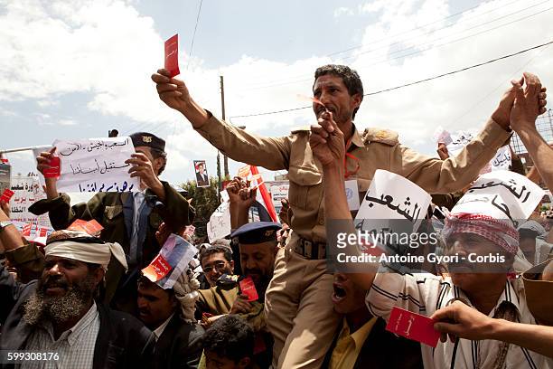 Thousands of People attend a demonstration against President Ali Abdullah Saleh in Sanaa, March 25 as Saleh and top dissident General Ali Mohsen...