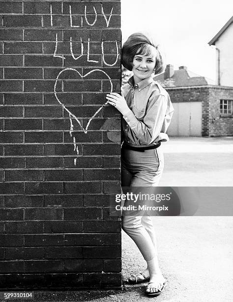 Years old Lulu real name Marie Lawrie from Glasgow who has made a debut disc entitled "Shout" with the Lovers. Pictured in school yard standing...