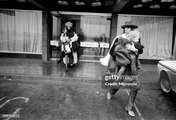 Rolling Stones: Keith Richards carrying his son Marlon and followed by Anita Pallenberg at their hotel in Newcastle upon Rolling Stones: Keith Richards carrying his son Marlon and followed by Anita Pallenberg at their hotel in Newcastle upon