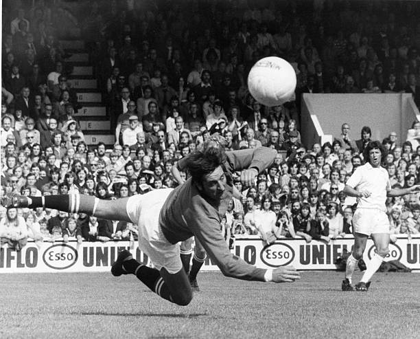 Leyton Orient v Manchester United league match at Brisbane Road August 1974. John Jackson goalkeeper for Orient pushes the ball to safety Final...