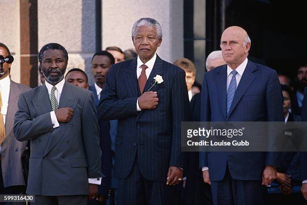 Newly elected President Nelson Mandela stands on the steps of Parliament after winning the first free Democratic election in South Africa after...