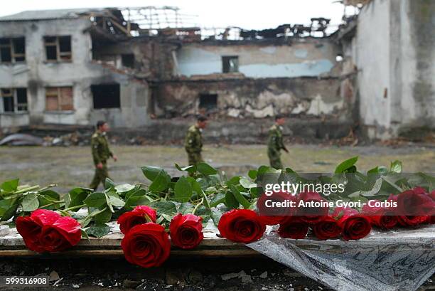 Soldiers patrol the crumbling remains of Beslan Number 1 school, the scene of the siege. For the moment, the buildings are still intact to enable...
