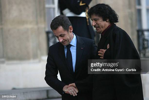French President Nicolas Sarkozy welcomes Libyan leader Muammar Gaddafi at the Elysee Palace for a second meeting during Gaddafi's official visit in...