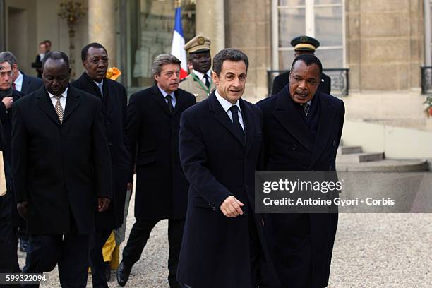 Central African President Francois Bozize, President Nicolas Sarkozy and Congolese President Denis Sassou-Nguesso leave the Elysee Palace in Paris...