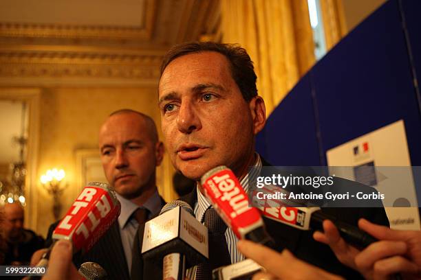 French Immigration Minister Eric Besson addresses the media after delivering a press conference as part of a nationwide debate launched by the French...