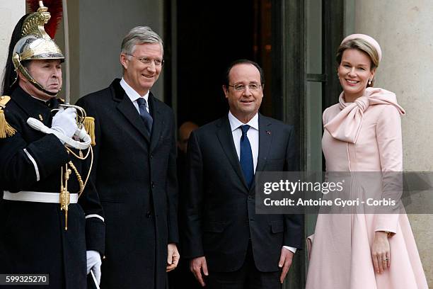 King Philippe of Belgium and Queen Mathilde of Belgium meet French president Francois Hollande during a one day official visit to Paris at the Elysee...