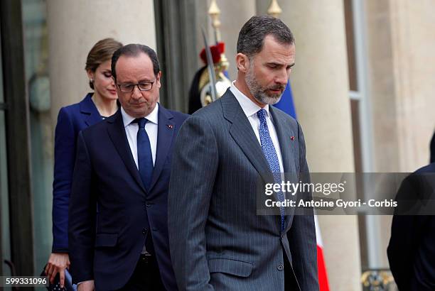 King Felipe of Spain, flanked by Queen Letizia, French President Francois Hollande are delivering a speech at the Elysée palace following the crash...