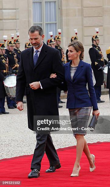 King Felipe and Queen Letizia of Spain are attending a meeting with French President François Hollande at the Elysée Palace