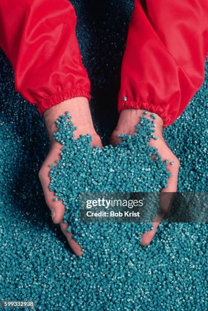 colored plastic pellets for bags - granule stockfoto's en -beelden