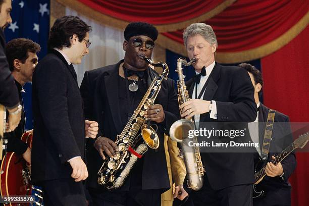 Bill Clinton playing saxophone during an inaugural ball after his election as US President.