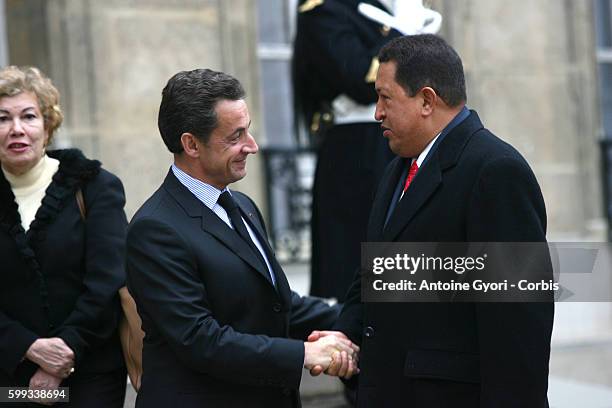 French President Nicolas Sarkozy welcomes Venezuelan President Hugo Chavez at the Elysee Palace.