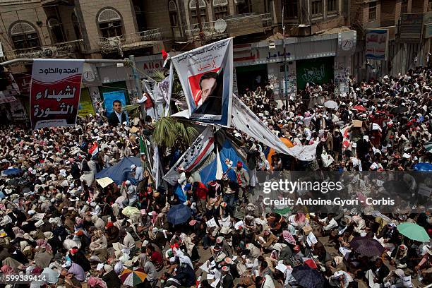 Thousands of People attend a demonstration against President Ali Abdullah Saleh in Sanaa, March 25 as Saleh and top dissident General Ali Mohsen...