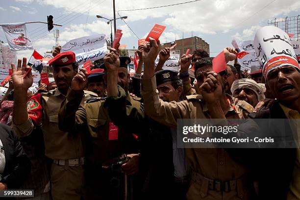 Thousands of People attend a demonstration against President Ali Abdullah Saleh in Sanaa, March 25 as Saleh and top dissident General Ali Mohsen...