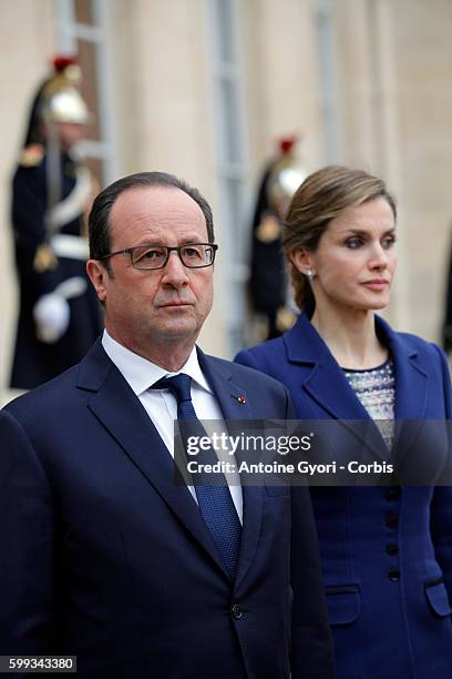 King Felipe of Spain, flanked by Queen Letizia, French President Francois Hollande are delivering a speech at the Elysée palace following the crash...