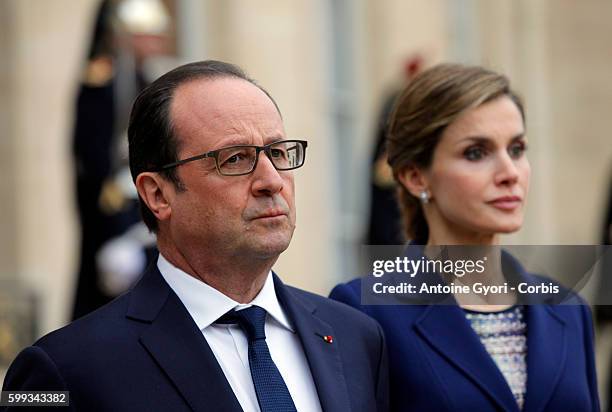 King Felipe of Spain, flanked by Queen Letizia, French President Francois Hollande are delivering a speech at the Elysée palace following the crash...