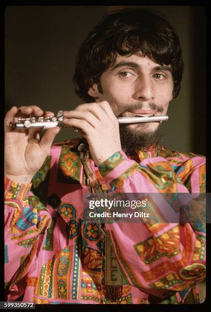 Lead singer Eddie Brigati of The Rascals plays the piccolo at a studio in Hollywood.