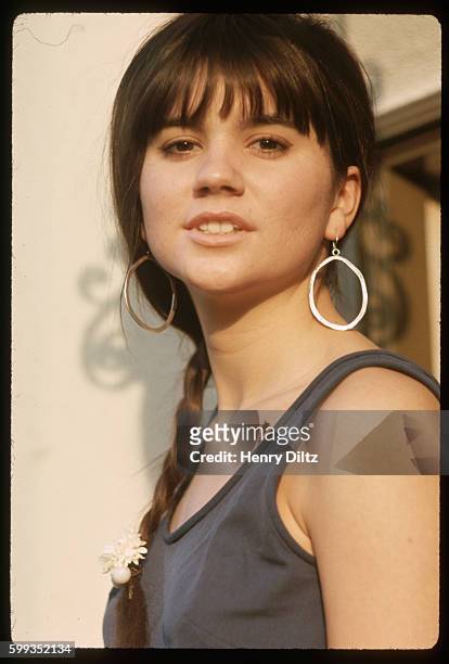 Singer Linda Ronstadt stands beside a wall at producer Nick Venet's house. At this time, Linda was a member of the Stone Ponies who had a hit with...