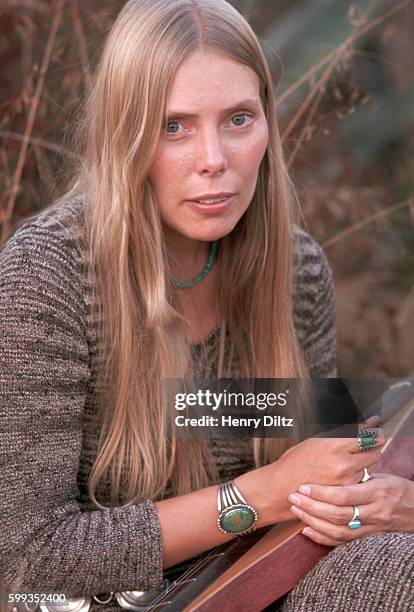 Singer-songwriter Joni Mitchell rests in a meadow at her Laurel Canyon home. Mitchell remains one of the most acclaimed songwriters and performers of...