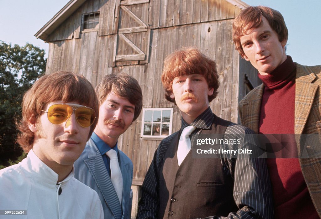 Sixties folk-rock band, Lovin' Spoonful stands beside a barn, wearing ...