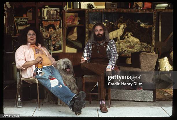 Known as "Flo and Eddie", the singers Mark Volman and Howard Kaylan lounge by a storefront. Volman and Kaylan were founding members of the Turtles,...