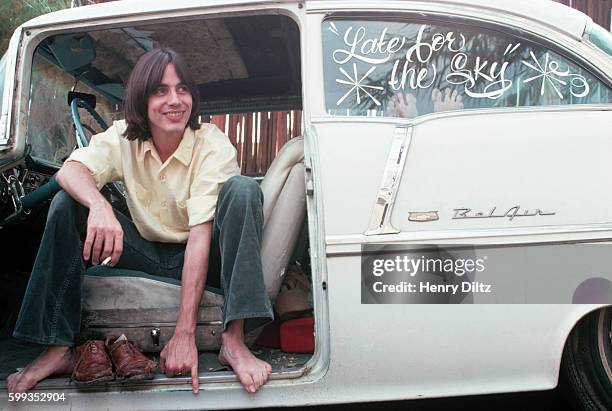 Singer-songwriter rests in an antique Chevy Bel-Air.