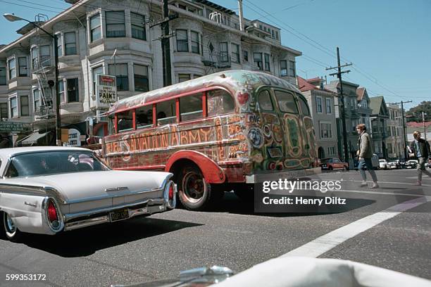 Psychedelic bus crosses an intersection in the Haight-Ashbury during The Summer of Love.