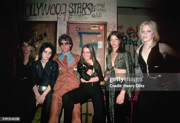 Producer Kim Fowley stands with Joan Jett, Lita Ford, Jackie Fox, and Cherie Currie of The Runaways at Los Angeles' Whiskey a Go Go.