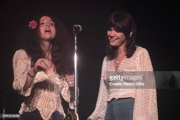 Singer Maria Muldaur performs with singer Linda Ronstadt during Rondstadt's 1974 concert at the Santa Monica Civic Auditorium.