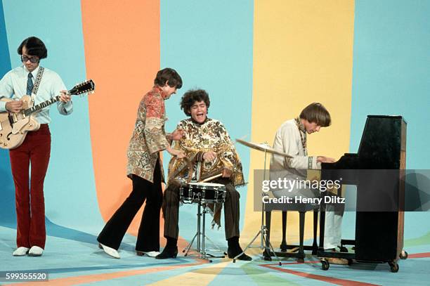 The Monkees play instruments and goof off on their television show.