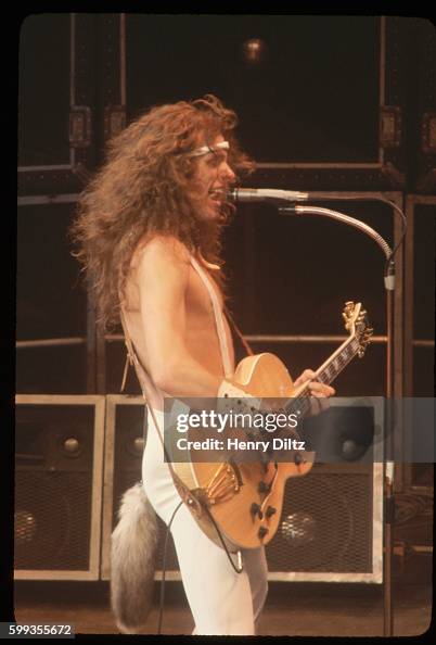 Wild-haired rock musician Ted Nugent, wearing a furry animal's tail ...