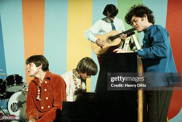 The Monkees sing and play instruments on their television show.