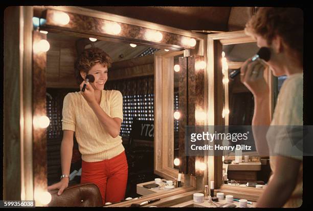 Kristy McNichol puts on makeup for a day on the set.