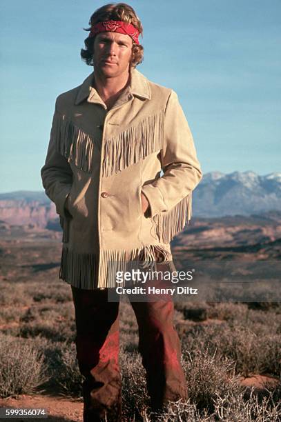 Actor Ryan O'Neal wears a red bandana around his head and a fringed leather jacket while on location for the motion picture Wild Rovers.