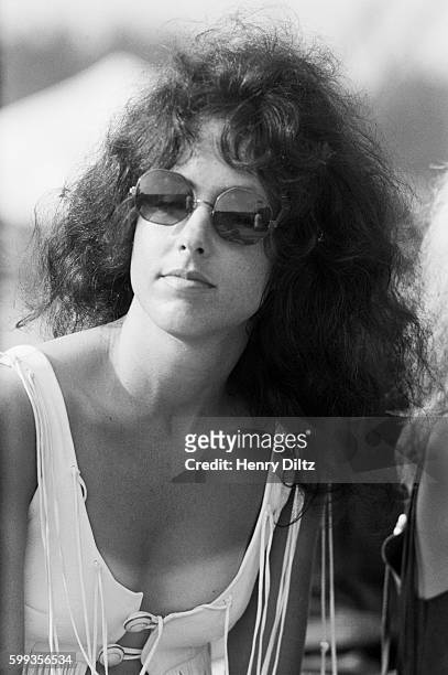 Jefferson Airplane singer Grace Slick sits backstage at the free Woodstock Music and Art Fair. The festival took place on Max Yasgur's dairy farm,...