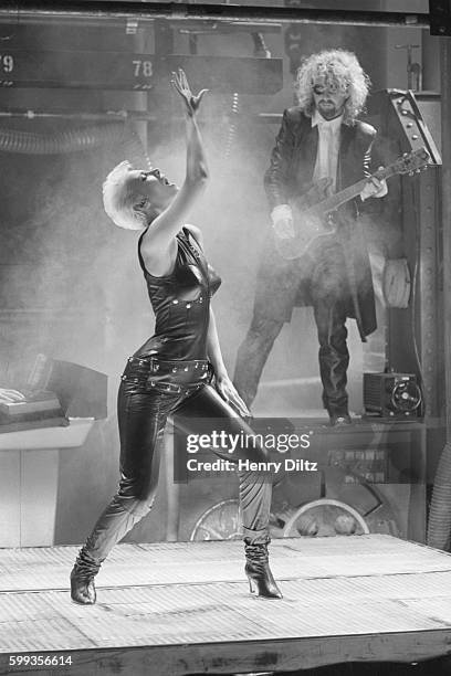 Annie Lennox dances and Dave Stewart plays guitar for the Eurythmics video "Missionary Man".