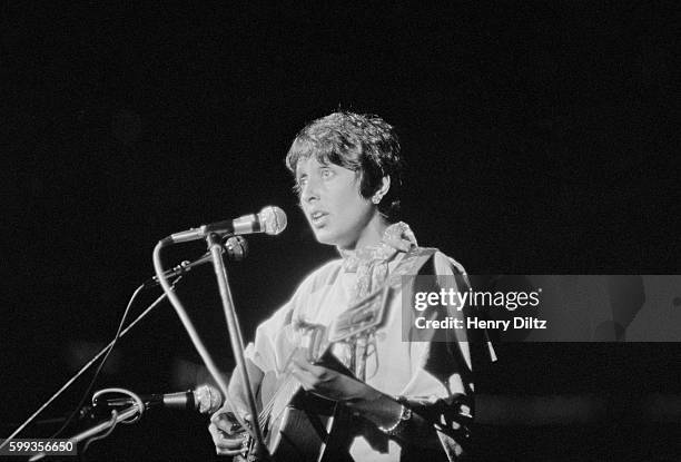 Folk singer Joan Baez performs at the free Woodstock Music and Art Fair. The festival took place on Max Yasgur's dairy farm, which he rented to event...