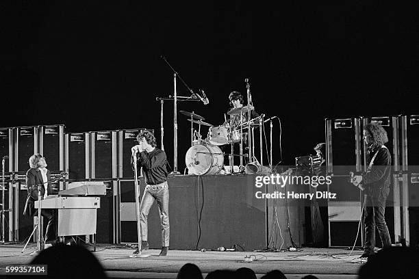 The Doors perform during a concert at the Hollywood Bowl in Los Angeles, California. From left to right: Keyboardist Ray Manzarek, singer Jim...