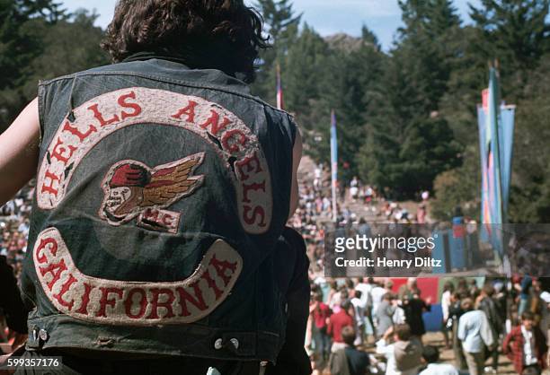 Member of the Hell's Angels motorcycle gang watches the crowd at the Magic Mountain Music Festival, a 1967 concert on Mount Tamalpais featuring the...
