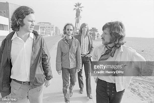 Los Angeles rock group The Doors, singer Jim Morrison, guitarist Robbie Krieger, keyboardist Ray Manzarek, and drummer John Densmore , walk along a...