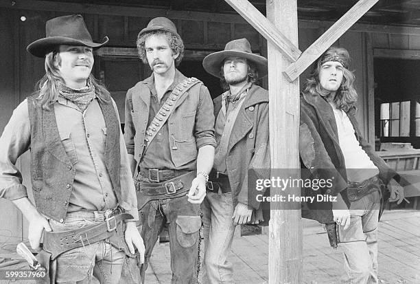 Members of the rock band The Eagles are dressed up in cowboy costumes for their Desperado album photo shoot. From left to right: Don Henley, Bernie...