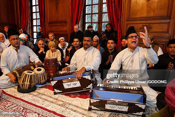 qawali singers performing at a sufi meeting in nandy castle, france. - sufi stock pictures, royalty-free photos & images