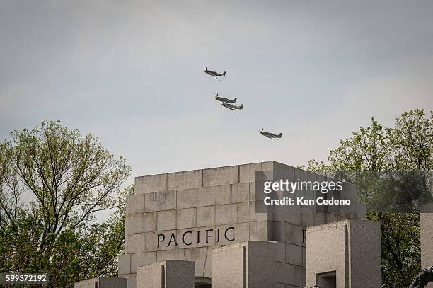 Vintage World War II planes fly over the National Mall during an array of other World War II aircraft ever assembled to fly over the National Mall...